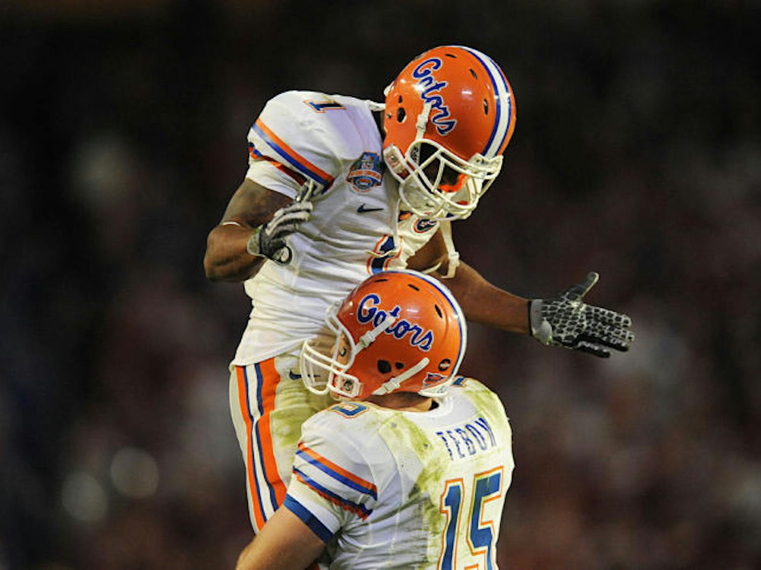 Quarterback Tim Tebow (15) embraces wide receiver Percy Harvin (1) during Florida’s 24-14 win against Oklahoma on Jan. 8, 2009, in the BCS National Championship Game in Miami.