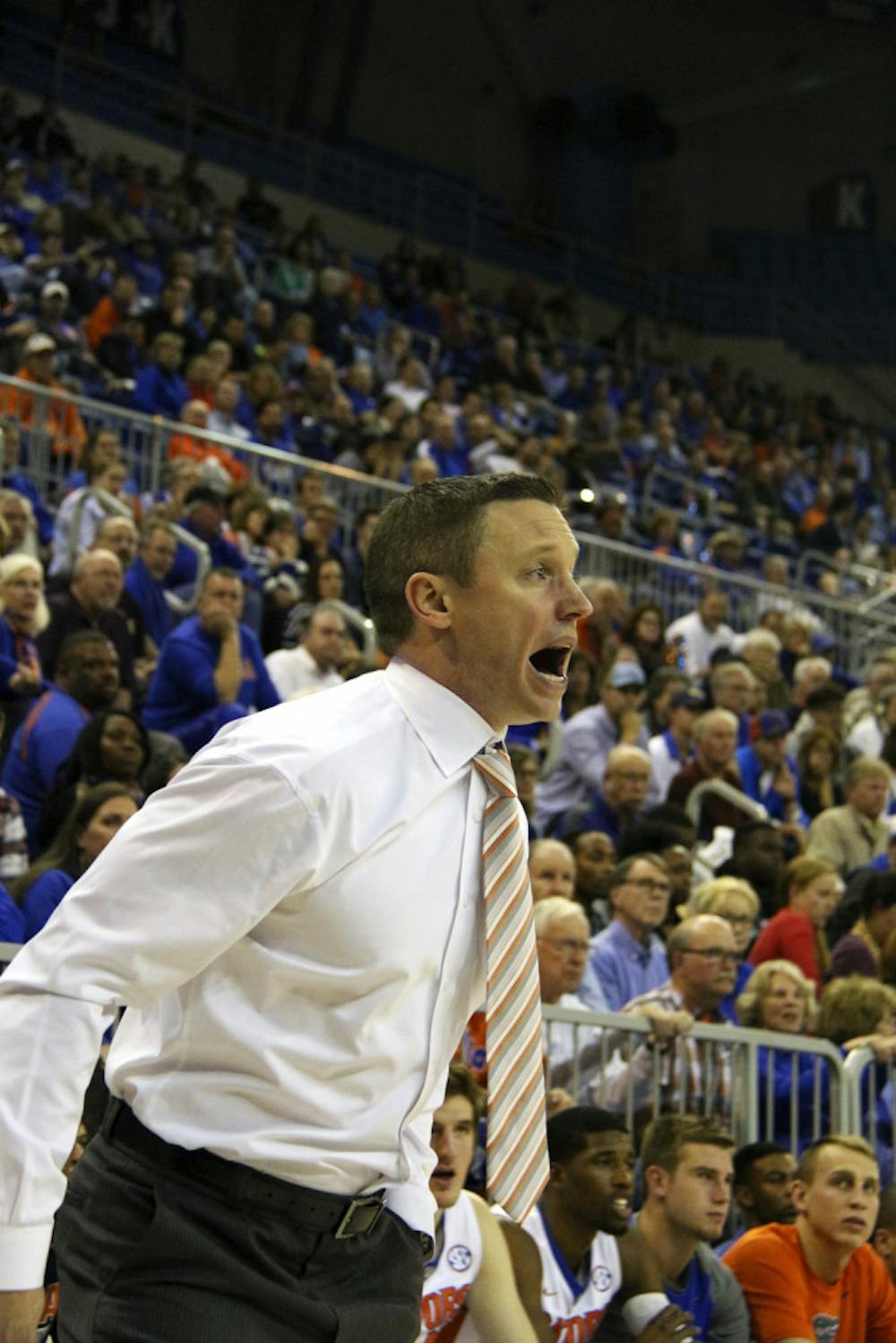 <p>Florida coach Mike White calls out a play from the sideline during Florida's 77-72 win over Ole Miss on Feb. 9, 2016, in the O'Connell Center. </p>