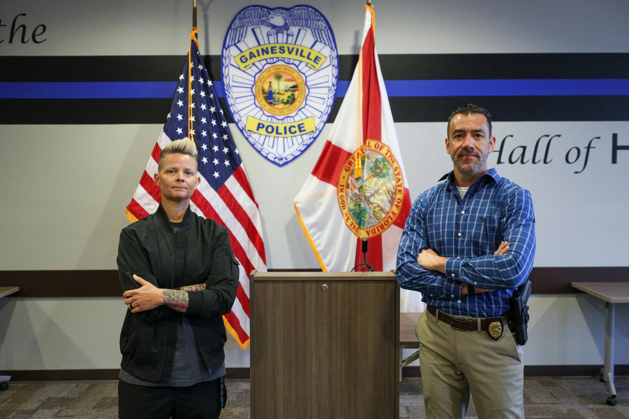 Donna Montague and Christopher King posing in front of the Gainesville Police conference room on Wednesday, Apr. 16, 2025.