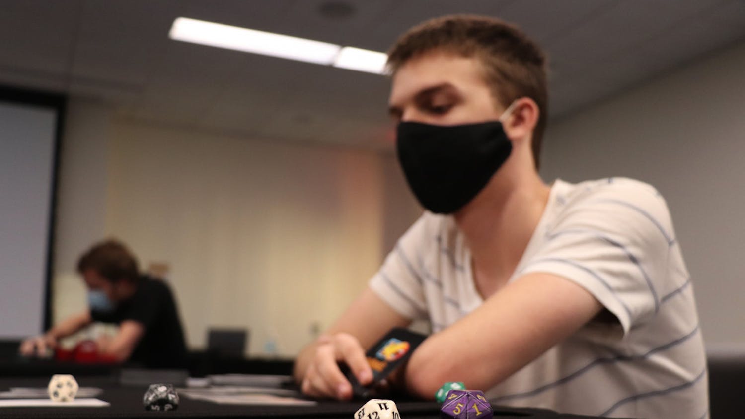 Ryan Feldbush, 19, a UF computer science sophomore, is seen playing ‘Magic: The Gathering’ at the Reitz Student Union on Wednesday, Sept. 30, 2020. Feldbush said he’s played the game for six years now. 