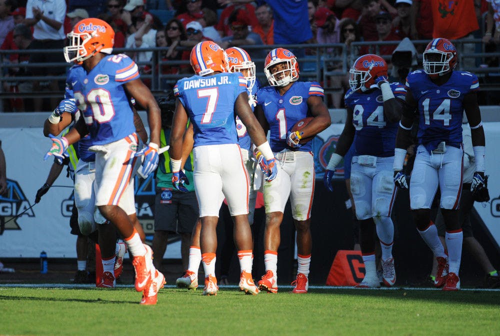 <p>UF defensive back Vernon Hargreaves III celebrates with teammates after an interception during the first half of Florida's 27-3 win against Georgia on Oct. 31, 2015, at EverBank Field in Jacksonville.</p>