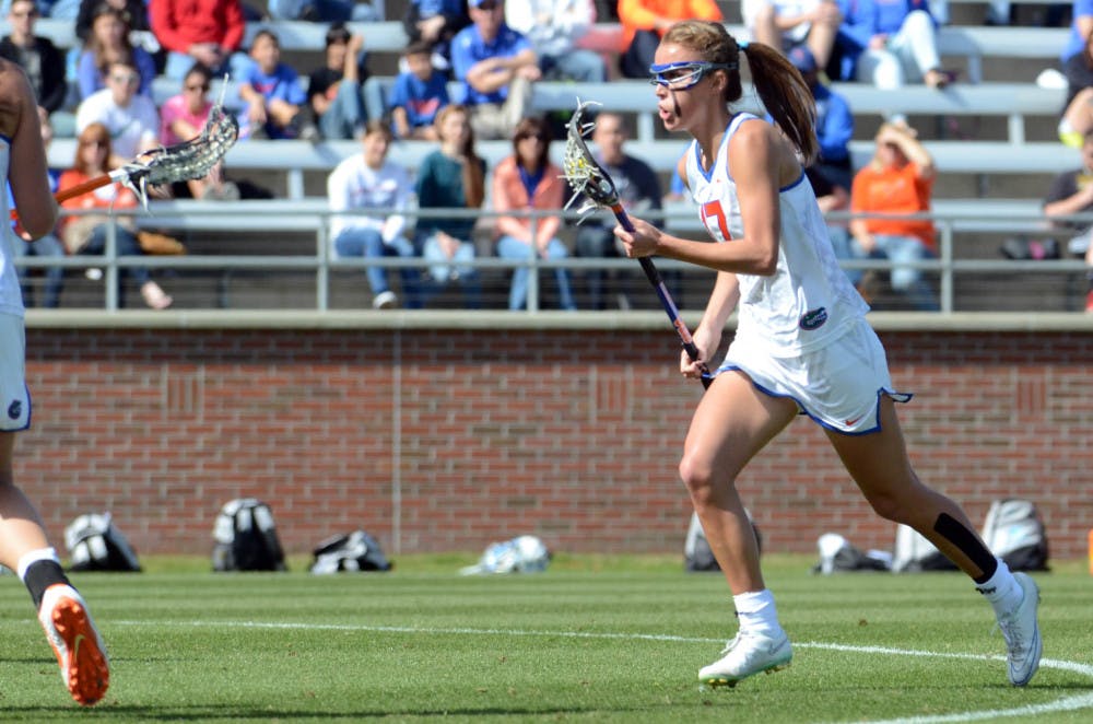 Sophomore midfielder Mollie Stevens runs down the field during UF's 17-11 loss to UNC on Saturday at Donald R. Dizney Stadium.