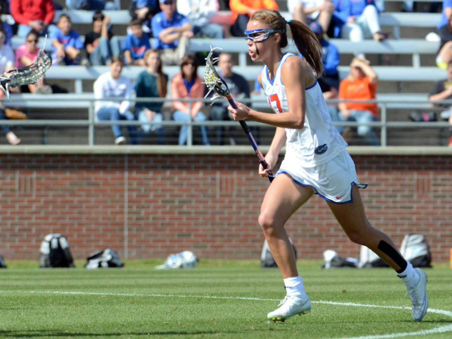 Sophomore midfielder Mollie Stevens runs down the field during UF's 17-11 loss to UNC on Saturday at Donald R. Dizney Stadium.