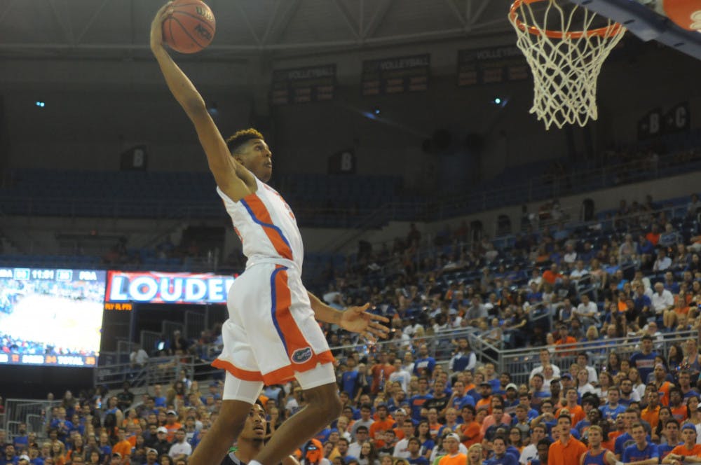 <p>UF forward Devin Robinson soars for a dunk during Florida's 89-42 exhibition win against Palm Beach Atlantic on Nov. 5, 2015, in the O'Connell Center.</p>