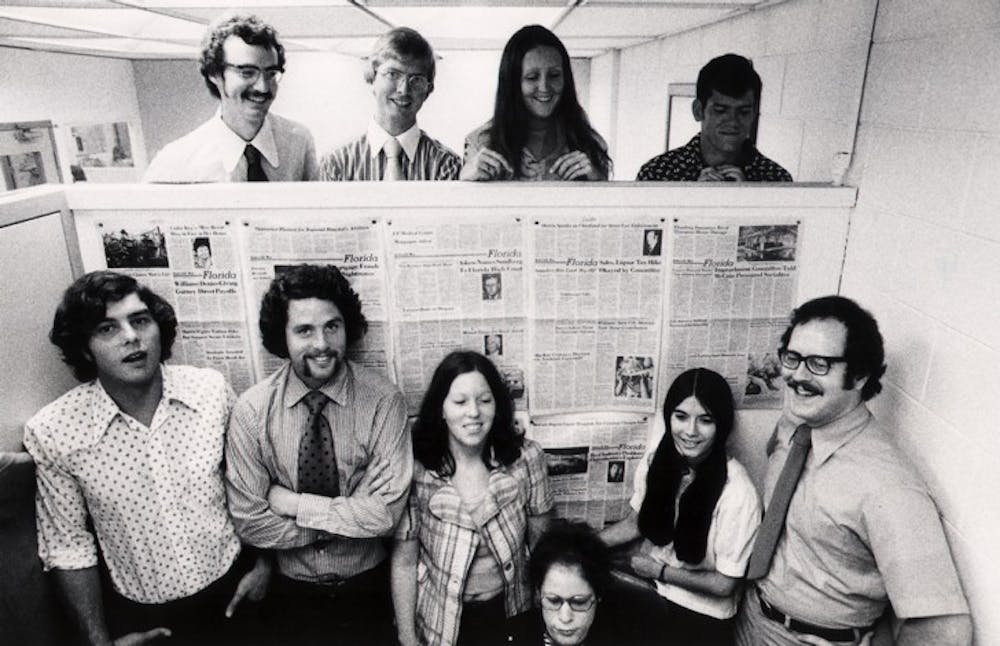 <p>Ed Weston, front row, far right, stands with students of an Applied Journalism class at The Gainesville Sun in the Spring quarter of 1975.</p>