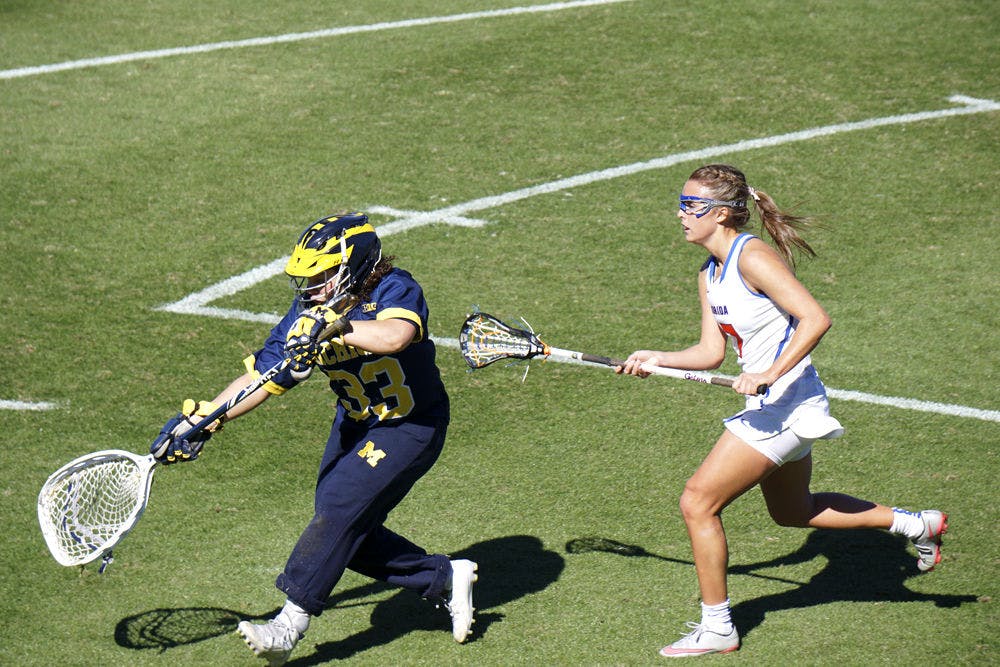 UF's Mollie Stevens attempts to make a play on the ball during Florida's 12-11 win over Michigan on Feb. 13, 2016, at Donald R. Dizney Stadium.&nbsp;