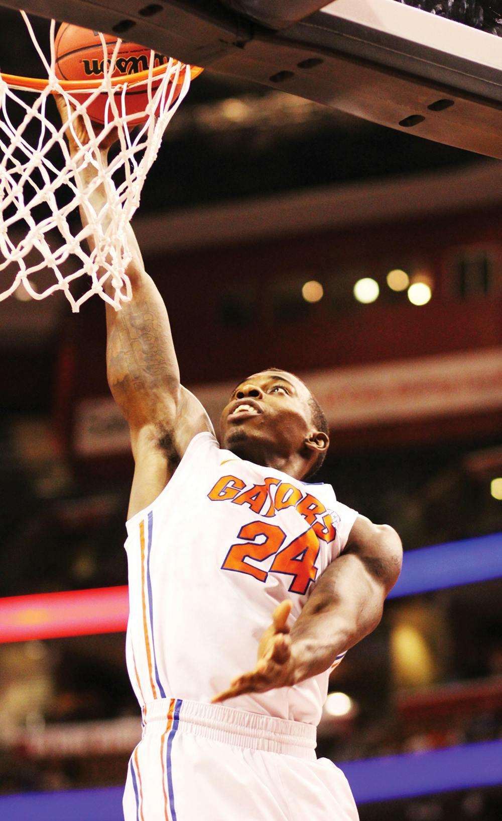 <p>Casey Prather finishes a layup during UF’s 78-61 win over Air Force on Dec. 29 at the Orange Bowl Classic in Sunrise.</p>