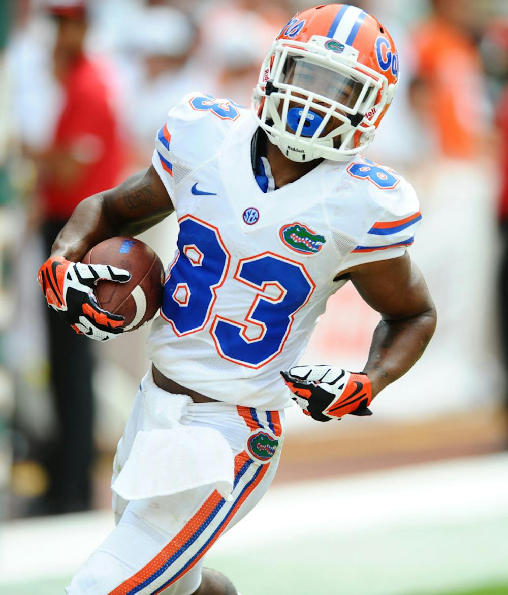 <p>Solomon Patton runs down the field after catching a pass during Florida’s 21-16 loss to Miami on Sept. 7 in Sun Life Stadium.</p>