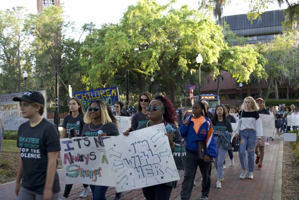 About 100 people attended the “Take Back the Night: March and Rally to end Sexual Violence,” to fight sexual assault and stand up for survivors of it. The group marched from Plaza of the Americas toward 13th Street and down West University Avenue.