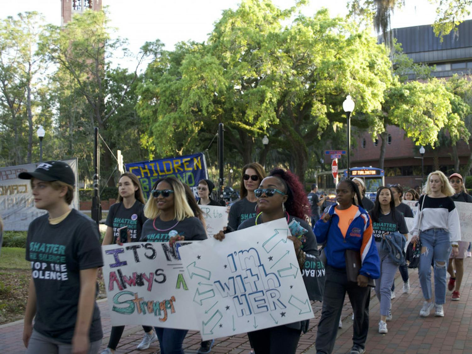 About 100 people attended the “Take Back the Night: March and Rally to end Sexual Violence,” to fight sexual assault and stand up for survivors of it. The group marched from Plaza of the Americas toward 13th Street and down West University Avenue.