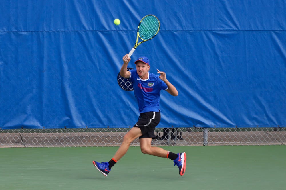 <p>Lukas Greif swings at a tennis ball on the fourth day of the ITA Tournament in Gainesville last season. He and Will Grant teamed up for a doubles win in South Carolina Friday.</p>