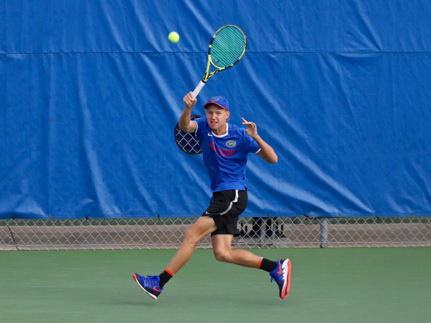 Lukas Greif swings at a tennis ball on the fourth day of the ITA Tournament in Gainesville last season. He and Will Grant teamed up for a doubles win in South Carolina Friday.