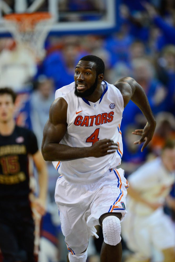 Senior center Patric Young runs down the floor during No. 15 Florida's 67-66 win against Florida State on Nov. 29, 2013, in the O'Connell Center.