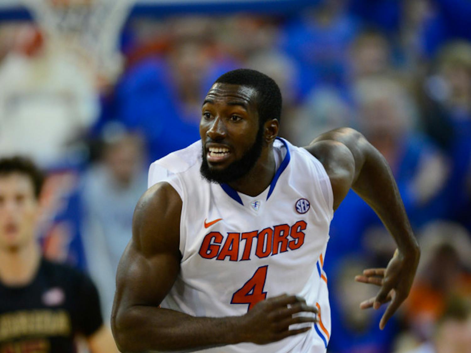 Senior center Patric Young runs down the floor during No. 15 Florida's 67-66 win against Florida State on Nov. 29, 2013, in the O'Connell Center.
