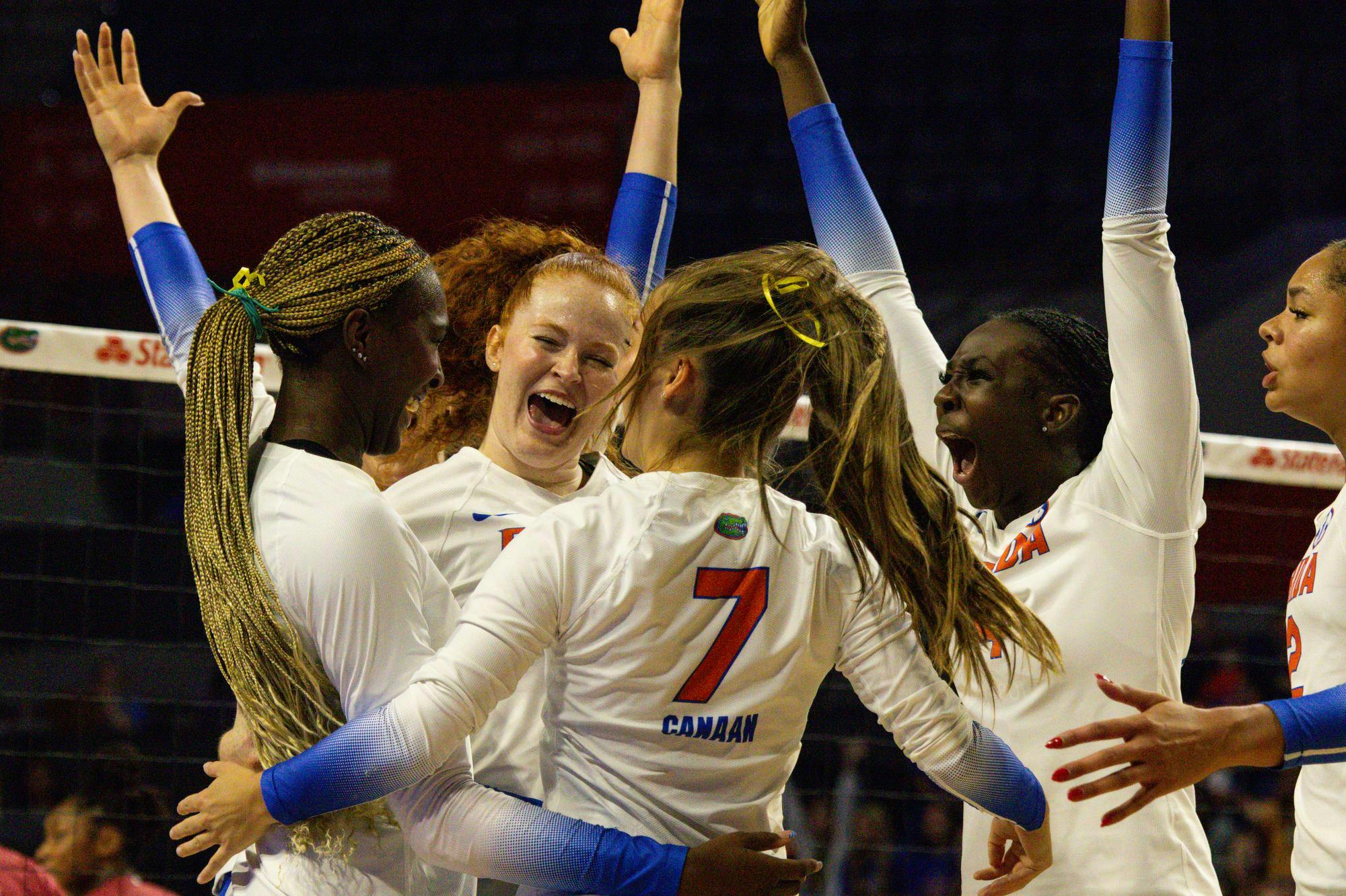 Florida volleyball players celebrate scoring a point against Alabama at the Stephen C. O'Connell Center on Sunday, Sept. 28, in Gainesville, Fla. 