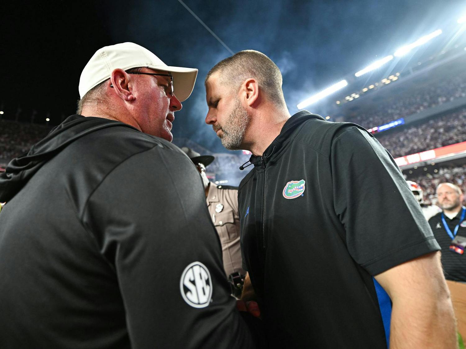 Texas A&M Aggies head coach Mike Elko and Florida Gators head coach Billy Napier meet at midfield after a NCAA college football game, Saturday, Oct. 11, 2025, in College Station, Texas.