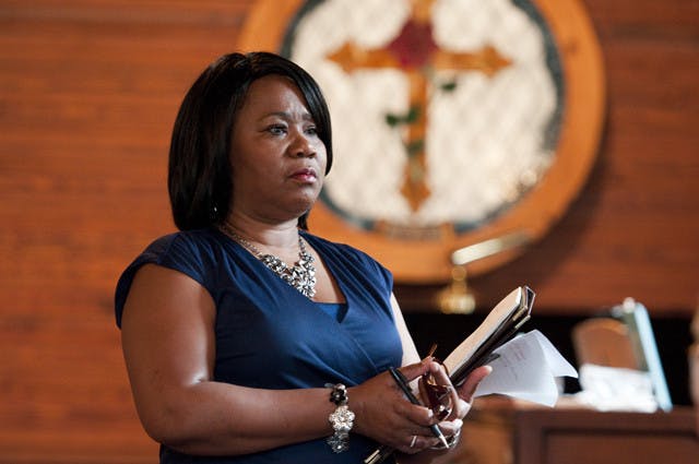U.S. Postal Service representative Carolyn Kirce spoke to about 70 Evinston residents Thursday evening about the potential closure of Wood and Swink Old Store's post office. Residents expressed their concerns about closing the historic landmark.