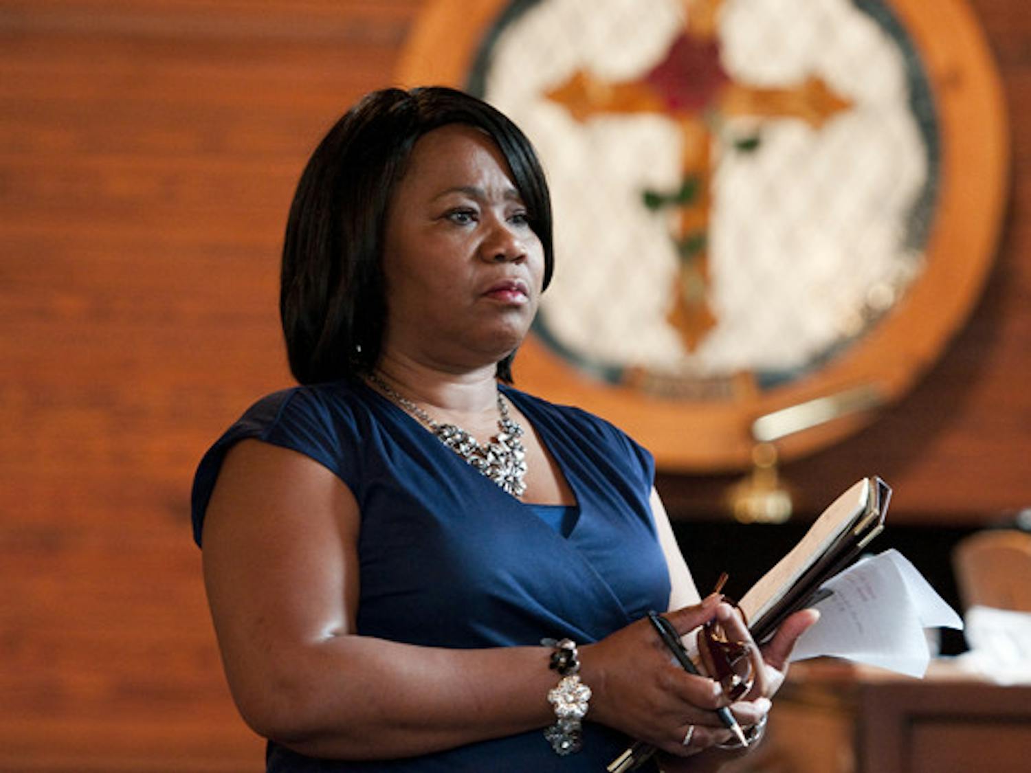 U.S. Postal Service representative Carolyn Kirce spoke to about 70 Evinston residents Thursday evening about the potential closure of Wood and Swink Old Store's post office. Residents expressed their concerns about closing the historic landmark.