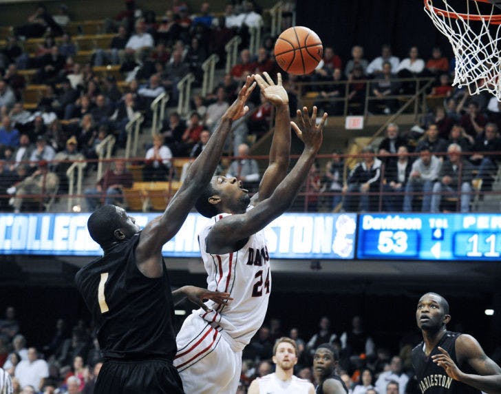Davidson’s De’Mon Brooks (24) shoots as College of Charleston’s Adjehi Baru (1) defends during the second half of the Southern Conference tournament final on March 11.