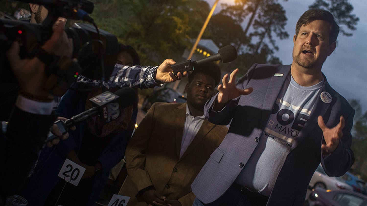 Lauren Poe speaks to a crowd of reporters and about 100 supporters Tuesday at the Public and General restaurant. Poe beat three opponents to win his second term as mayor of Gainesville.
