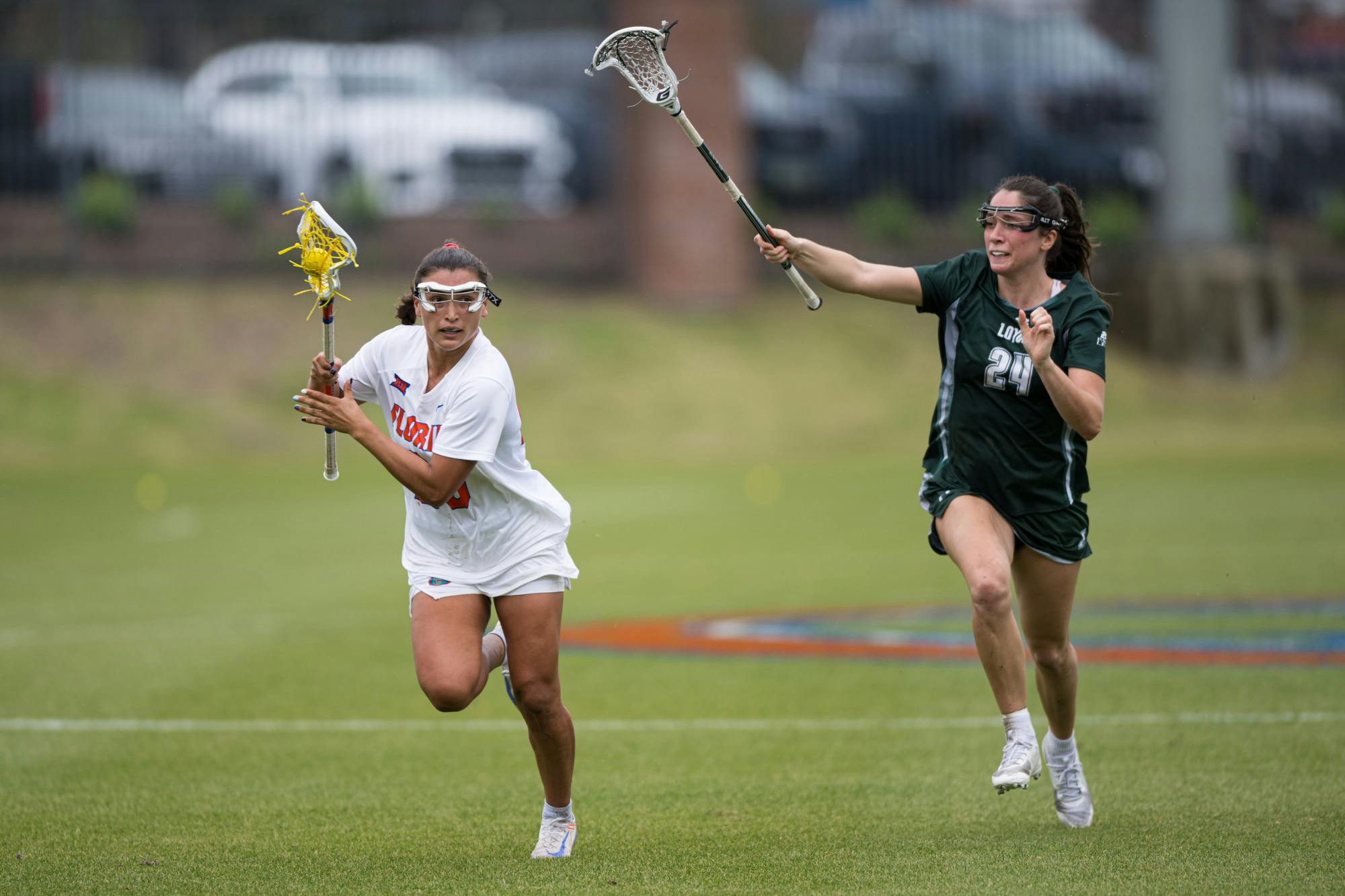 Florida Gators defender Celeste Forte (20) runs with the ball in a lacrosse game against Loyola Maryland in Gainesville, Fla., on Saturday, March 8, 2025.