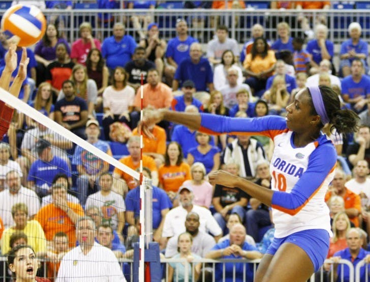 Junior middle blocker Chloe Mann hits the ball over the net in Florida’s 3-0 win against Arkansas on Oct. 5, 2012, in the O’Connell Center.&nbsp;