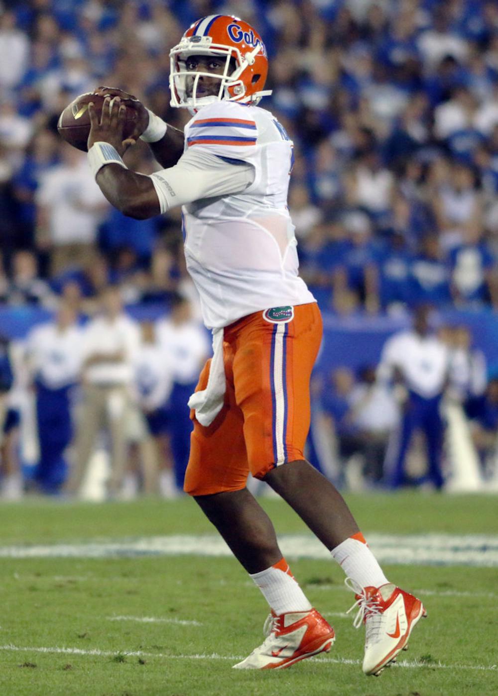 <p>Tyler Murphy attempts a pass during Florida’s 24-7 victory against Kentucky on Saturday at Commonwealth Stadium in Lexington, Ky.</p>