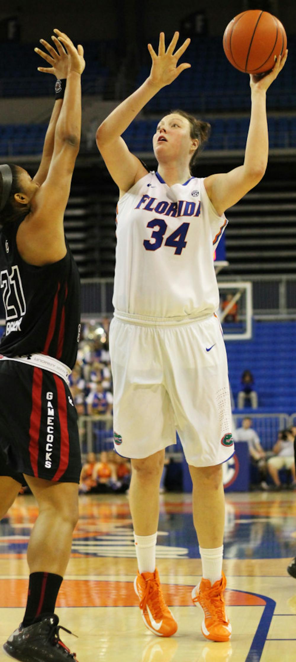 <p>Florida center Vicky McIntyre (34) attempts a shot over a South Carolina defender in the O'Connell Center during Florida's 52-44 loss to South Carolina. After one season with the Gators, McIntyre will not return to UF next season. </p>