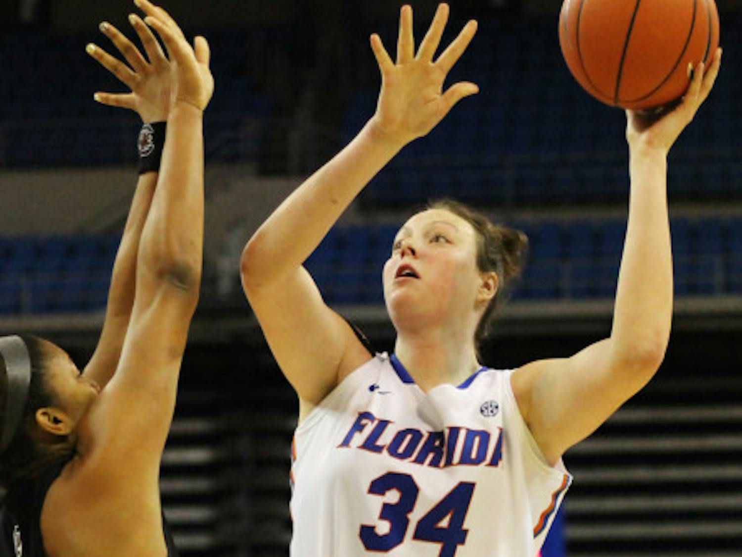 Florida center Vicky McIntyre (34) attempts a shot over a South Carolina defender in the O'Connell Center during Florida's 52-44 loss to South Carolina. After one season with the Gators, McIntyre will not return to UF next season. 