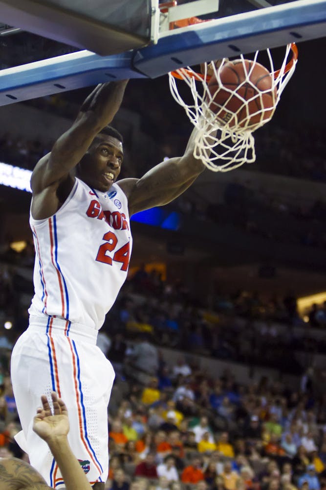Florida's Casey Prather (24) dunks against Virginia during an NCAA college basketball tournament game at CenturyLink Center in Omaha, Neb., Friday, March 16, 2012. Florida won 71-45. (AP Photo/The Kansas City Star, David Eulitt)