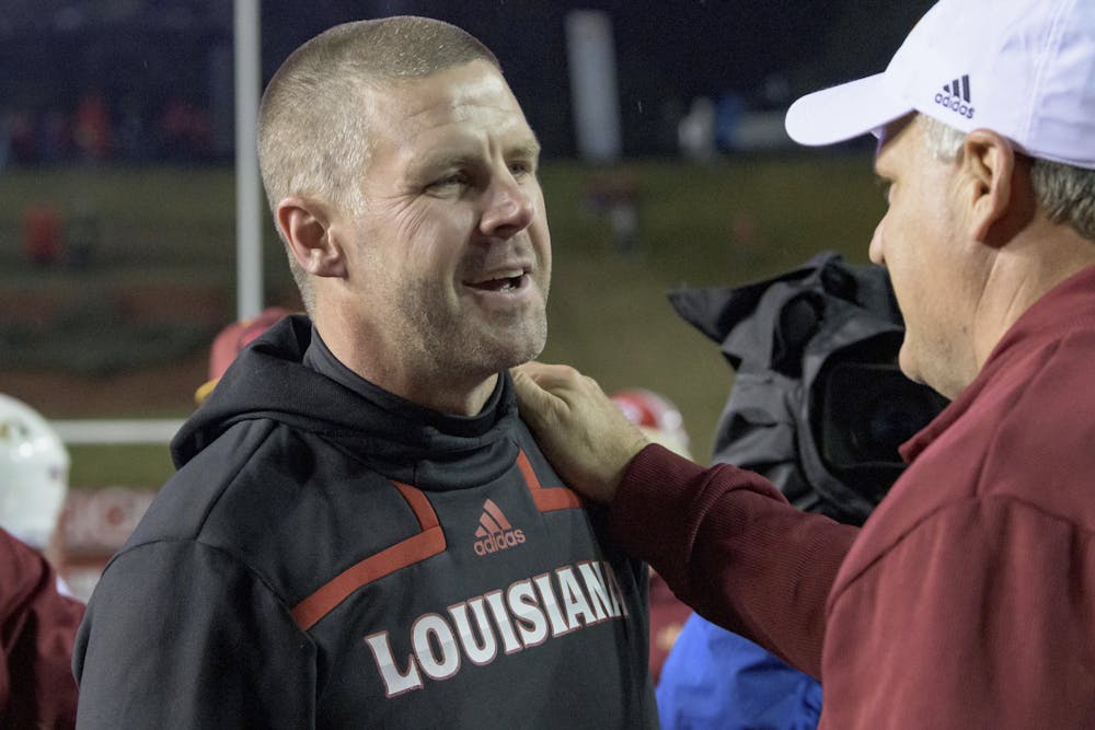 <p>Louisiana-Lafayette head coach Billy Napier is congratulated by Louisiana-Monroe Offensive Coordinator Rich Rodriguez after Louisiana-Lafayette won 21-16 in an NCAA college football game in Lafayette, La., Saturday, Nov. 27, 2021. (AP Photo/Matthew Hinton) Napier will be reunited with former running back Montreal Johnson in Gainesville next year.</p>