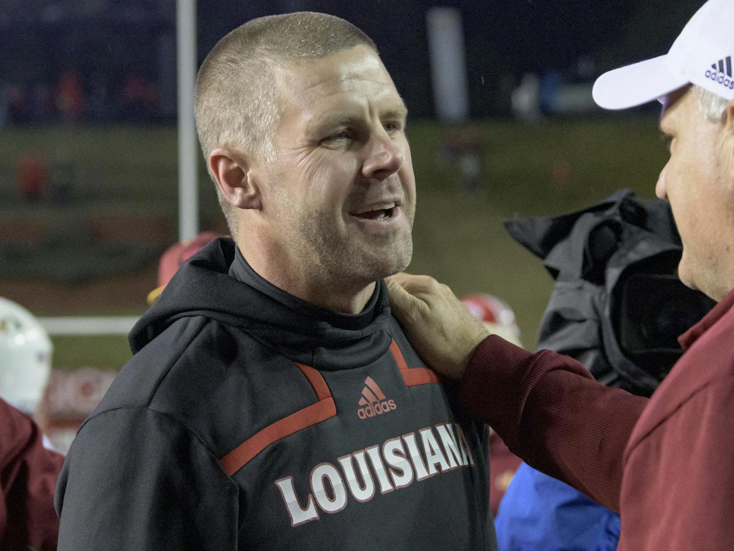 Louisiana-Lafayette head coach Billy Napier is congratulated by Louisiana-Monroe Offensive Coordinator Rich Rodriguez after Louisiana-Lafayette won 21-16 in an NCAA college football game in Lafayette, La., Saturday, Nov. 27, 2021. (AP Photo/Matthew Hinton) Napier will be reunited with former running back Montreal Johnson in Gainesville next year.