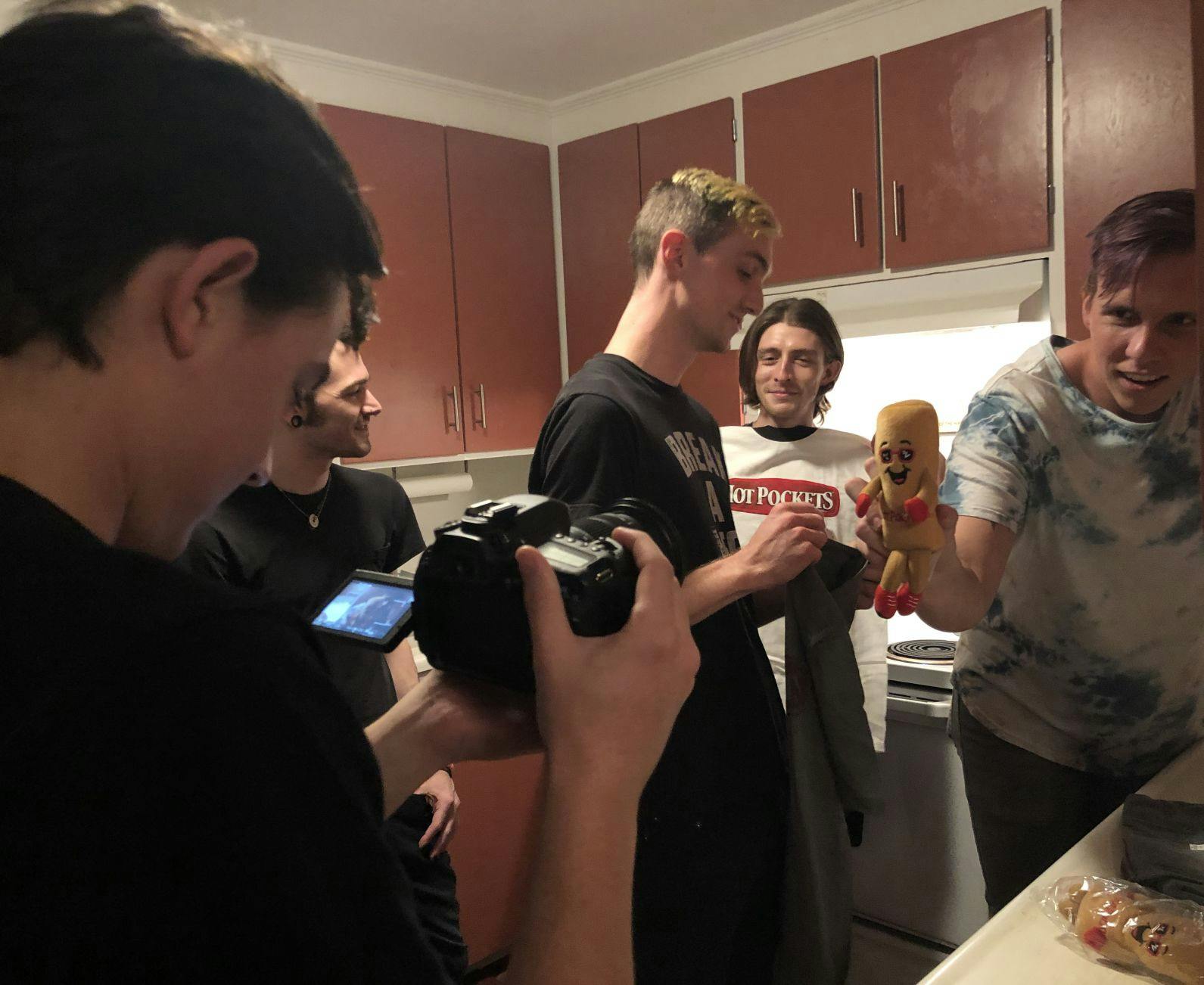 Behind the scenes of Arrows in Action’s Hot Pockets unboxing video. The band’s manager, Jacob McKay, films bassist Tony Farah, guitarist Matt Fowler, lead vocalist Victor Viramontes-Pattison and drummer Jesse Frimmel (from left to right).