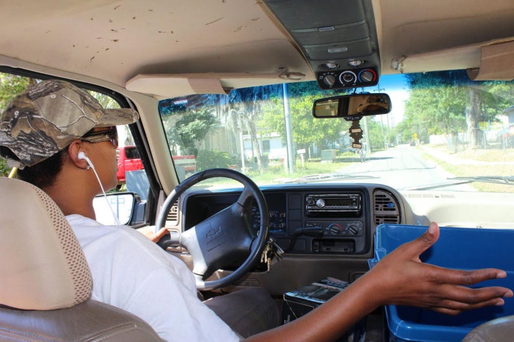 GiGi Simmons, 44, drives around Gainesville’s Porters Community overseeing about 10 groups of UF students as they volunteered outside residents’ homes on Saturday. It was a part of UF Student Government’s inaugural The Big Event, a daylong service event in which about 760 students volunteered at about 45 locations across Gainesville.