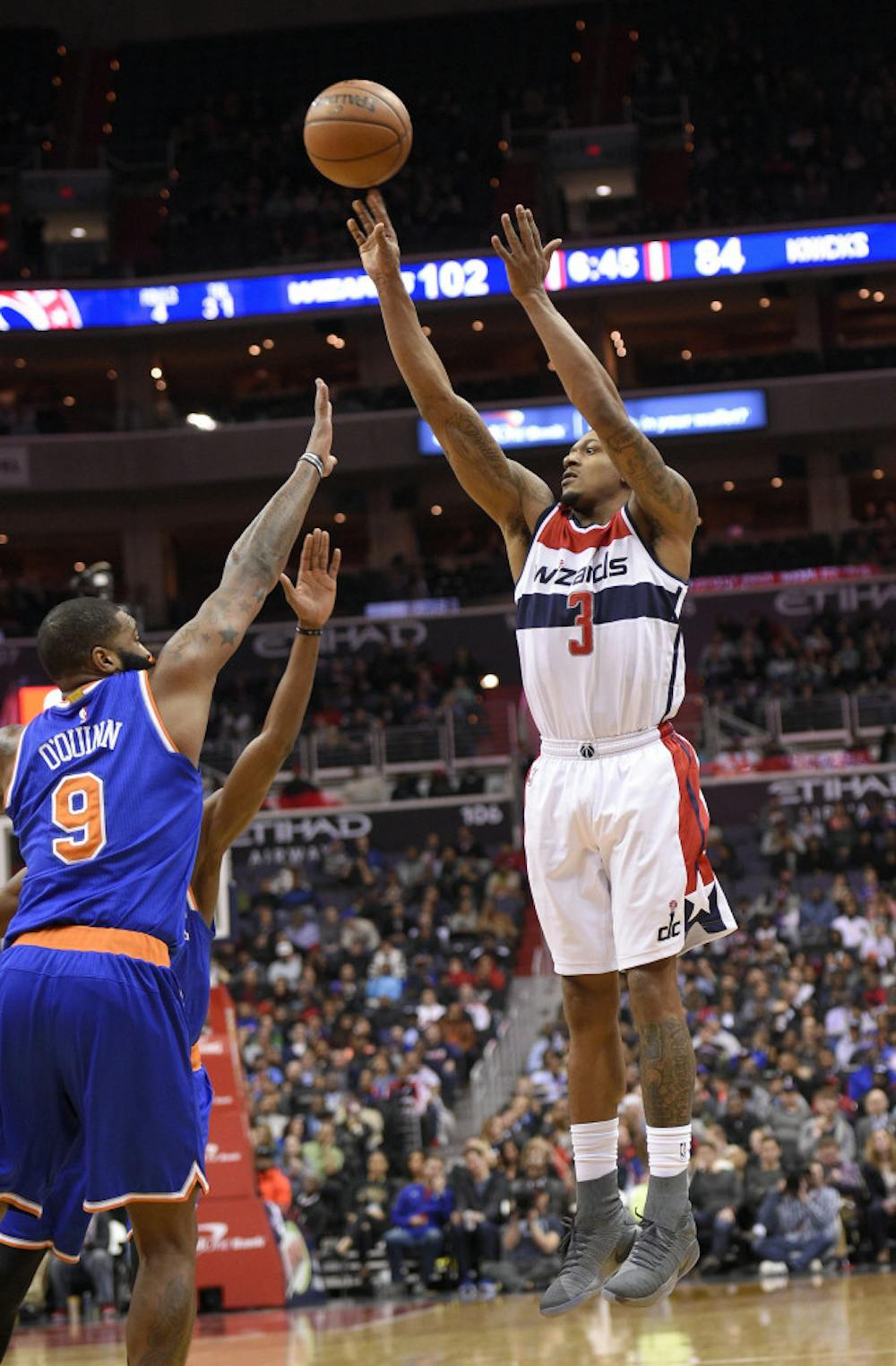 <p>Washington Wizards guard Bradley Beal (3) shoots against New York Knicks center Kyle O'Quinn (9) during the second half of an NBA basketball game, Tuesday, Jan. 31, 2017, in Washington. The Wizards won 117-101. (AP Photo/Nick Wass)</p>