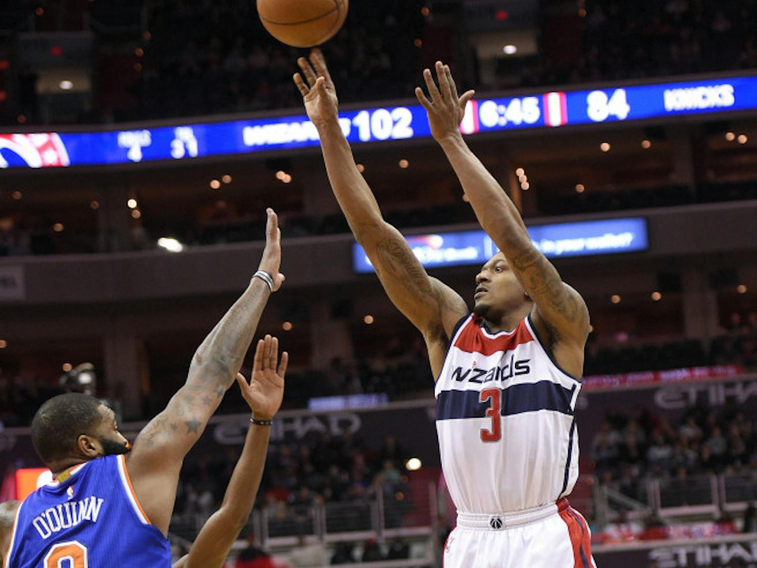 Washington Wizards guard Bradley Beal (3) shoots against New York Knicks center Kyle O'Quinn (9) during the second half of an NBA basketball game, Tuesday, Jan. 31, 2017, in Washington. The Wizards won 117-101. (AP Photo/Nick Wass)