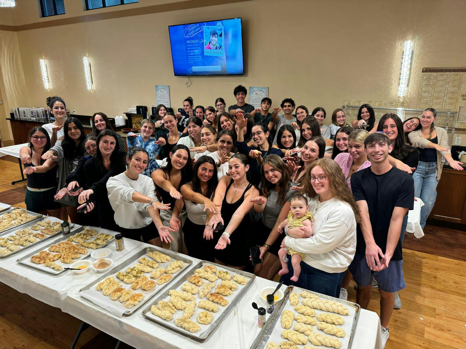 Members of Chabad UF Jewish Student and Community Center bake Challah for Shabbat dinner.&nbsp;Photo courtesy of Lexi Szafranski.