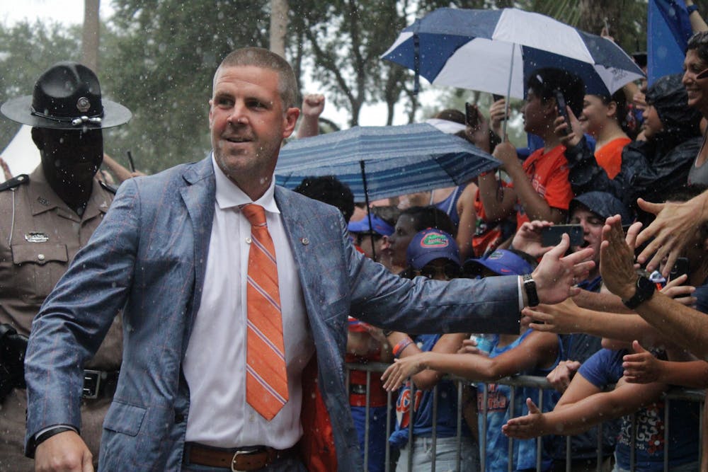 Florida head coach Billy Napier greeting fans during Gator Walk Saturday, Sept. 3, 2022.
