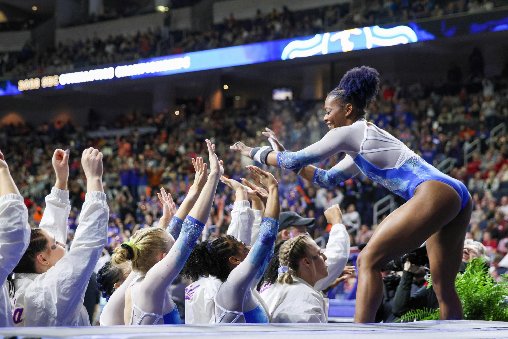 Trinity Thomas celebrates with her teammates during the Southeastern Conference Championships Saturday, March 18, 2023.