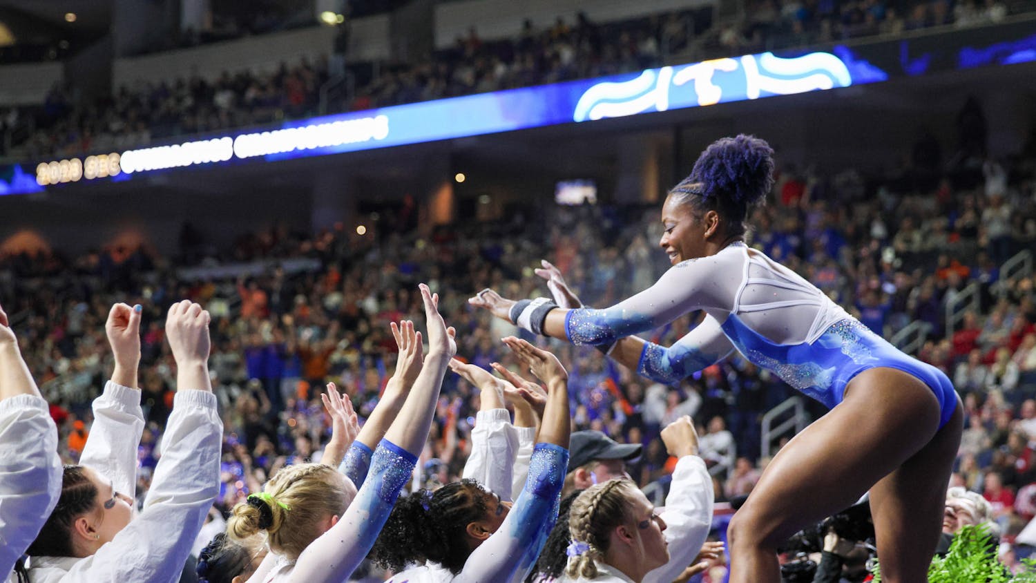 Trinity Thomas celebrates with her teammates during the Southeastern Conference Championships Saturday, March 18, 2023.