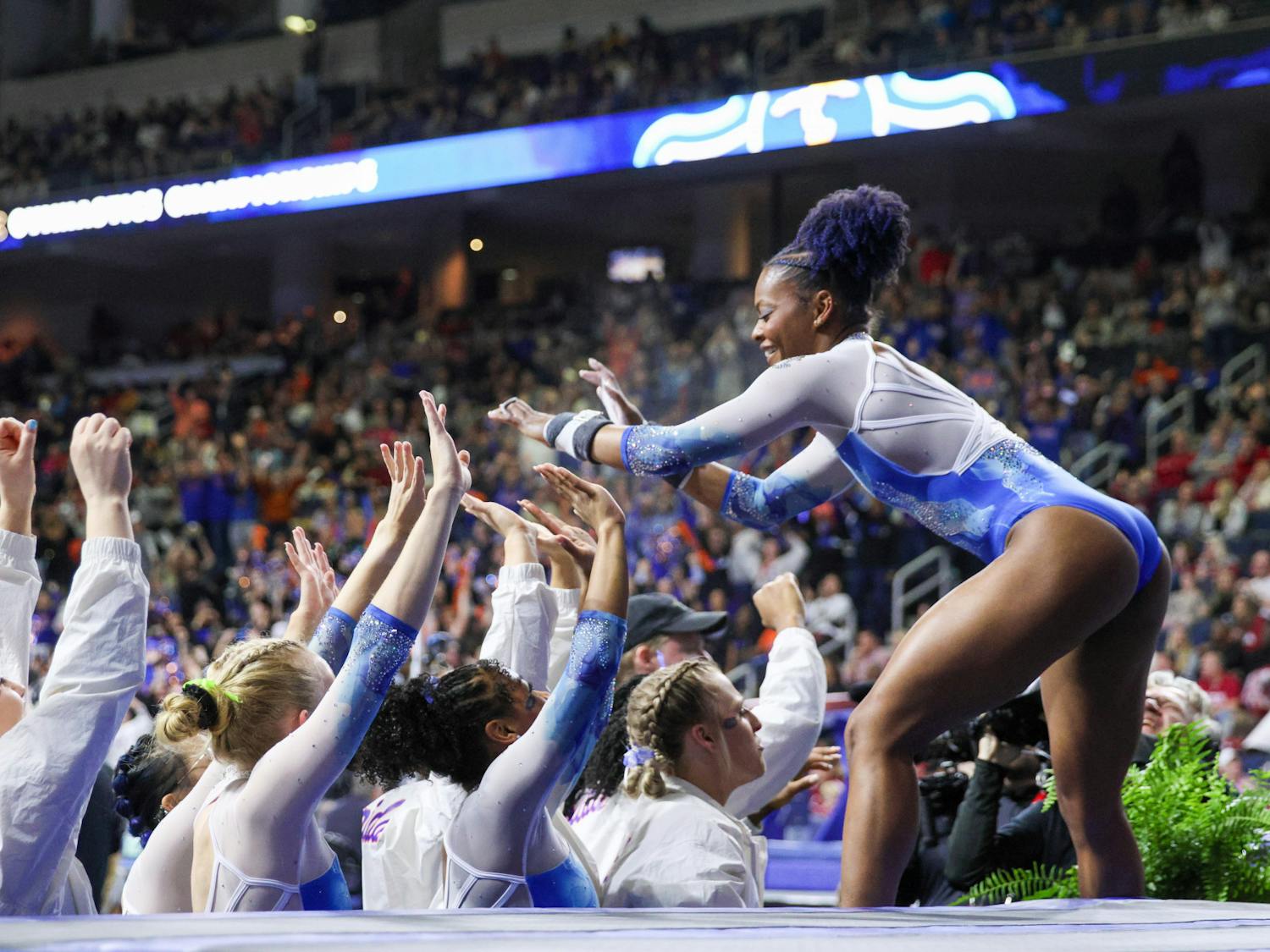 Trinity Thomas celebrates with her teammates during the Southeastern Conference Championships Saturday, March 18, 2023.