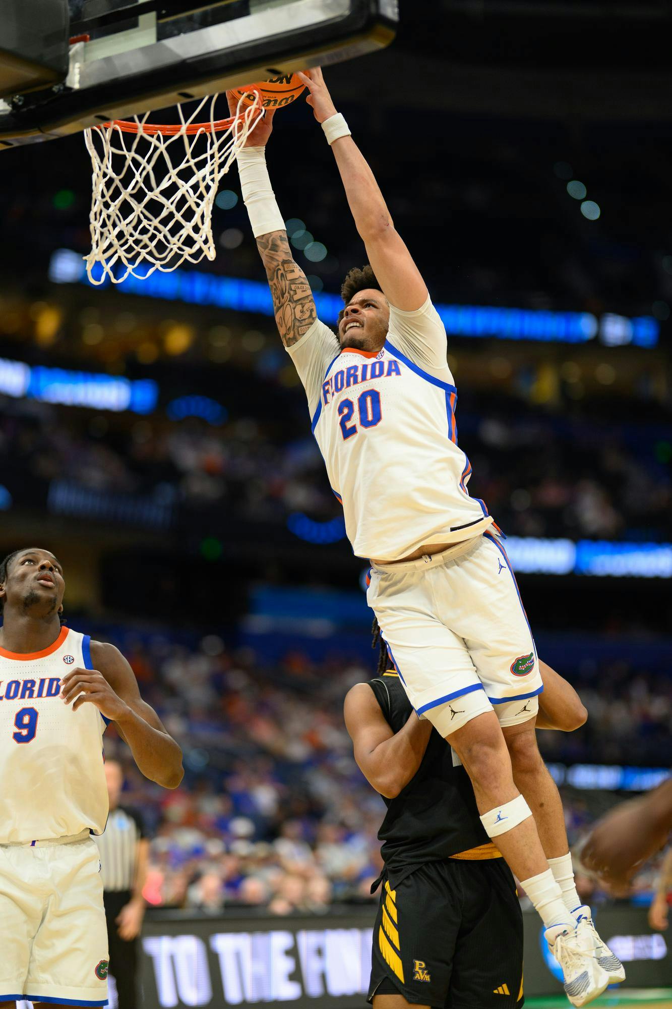 Florida guard Isaiah Brown (20) dunks during the second half of an NCAA Tournament first round game against Prairie View A&M, Friday, March 20, 2026, in Tampa, Fla.