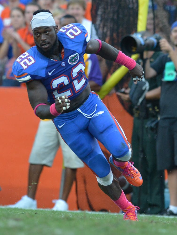 Safety Matt Elam runs to the sideline after losing his helmet while making a tackle during Florida's 14-6 win against LSU on Saturday at Ben Hill Griffin Stadium. The junior safety earned SEC Co-Defensive Player of the Week.