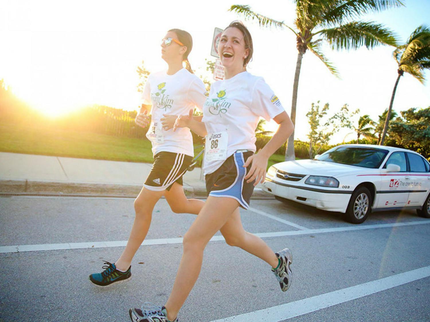 Sarah Lambert, 21, jogging with friend, Ryenne Dietrick, 17 at Race for Hope –&nbsp;Aid to Victims of Domestic Abuse in Delray Beach.