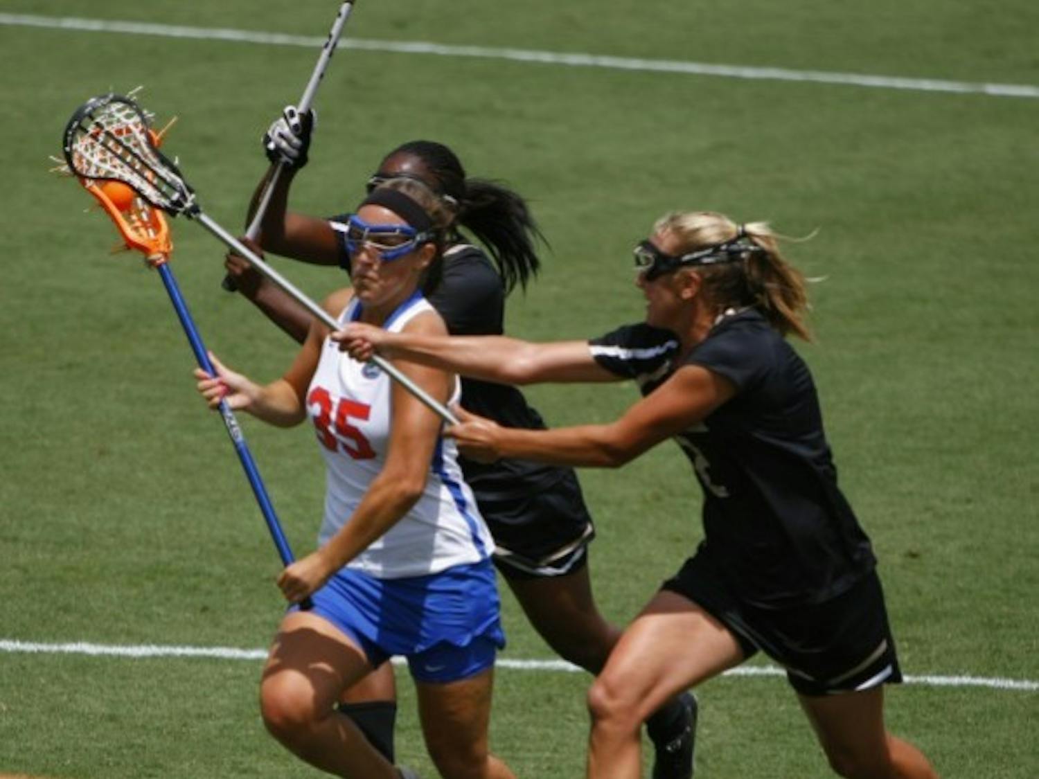 Florida attacker Gabi Wiegand drives between two defenders in a game against Vanderbilt on April 14. Wiegand scored the game-winning goal in Florida’s 8-7 win over Northwestern on Saturday.