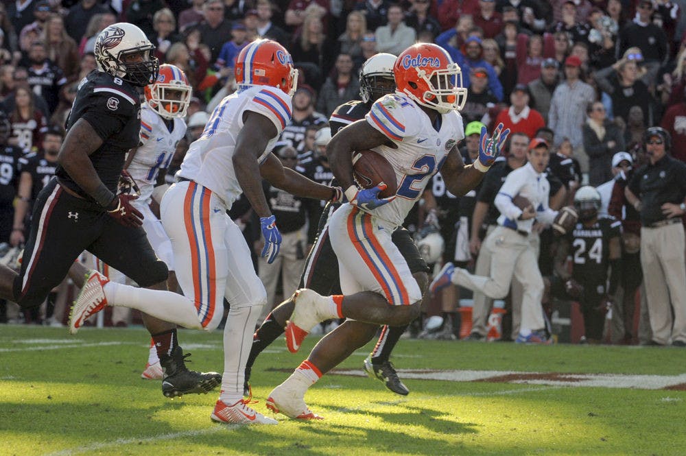 <p>UF running back Kelvin Taylor dashes for a 53-yard run during the fourth quarter of Florida's 24-14 win against South Carolina on Nov. 14, 2015, at Williams-Brice Stadium in Columbia, South Carolina.</p>