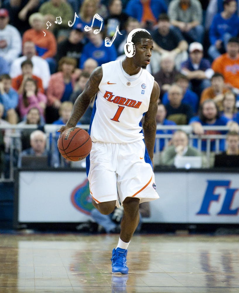 Kenny Boynton dribbles the ball down the court in the Stephen O’Connell Center.