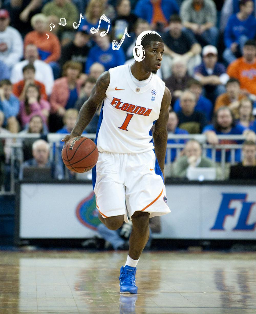 Kenny Boynton dribbles the ball down the court in the Stephen O’Connell Center.