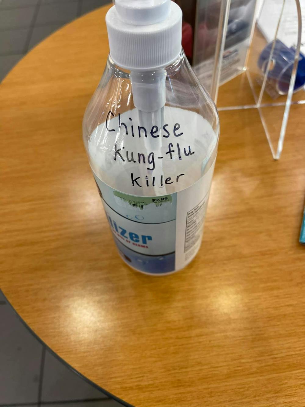 Gainesville Nissan customer Larry Katz found a sanitizer bottle with the racist message, "Chinese Kung-flu Killer" written in black ink in the dealership storeroom. [Photo courtesy of Larry Katz.]