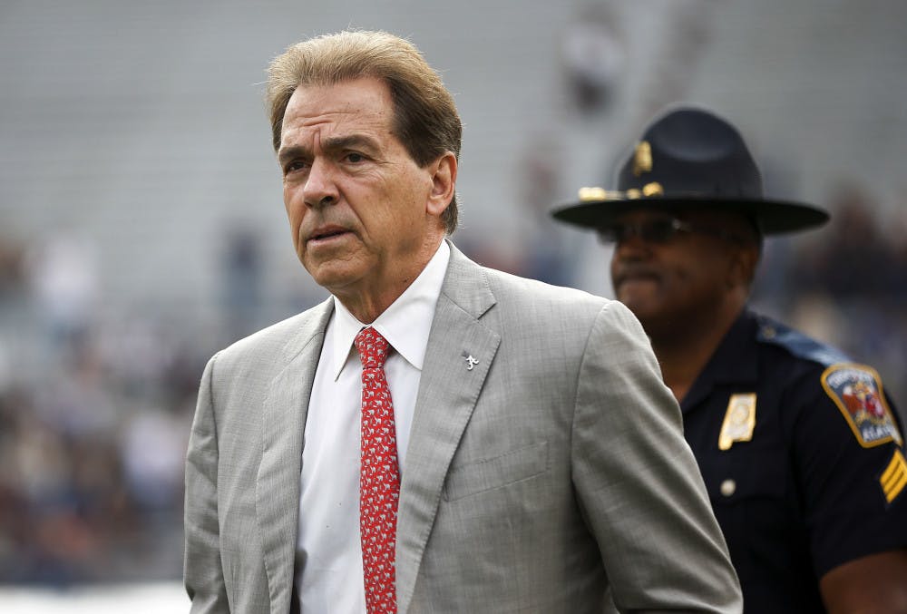 FILE - In this Nov. 25, 2017, file photo, Alabama head coach Nick Saban walks the field before the Iron Bowl NCAA college football game against Auburn, in Auburn, Ala. The Associated Press voters prefer Alabama over Ohio State. In the final Top 25 of the regular season, the Crimson Tide was No. 4 and the Buckeyes were No. 5. (AP Photo/Brynn Anderson, File)